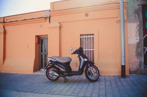 a scooter is parked in front of a building