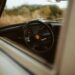 the interior of a car with a steering wheel and dashboard